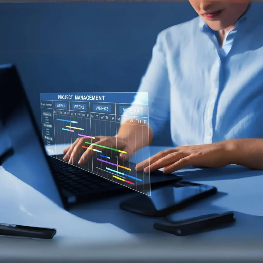 Woman working on laptop with project management software.